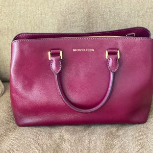 Rich burgundy Michael Kors bag.